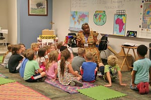 Teacher reads to a classroom of children